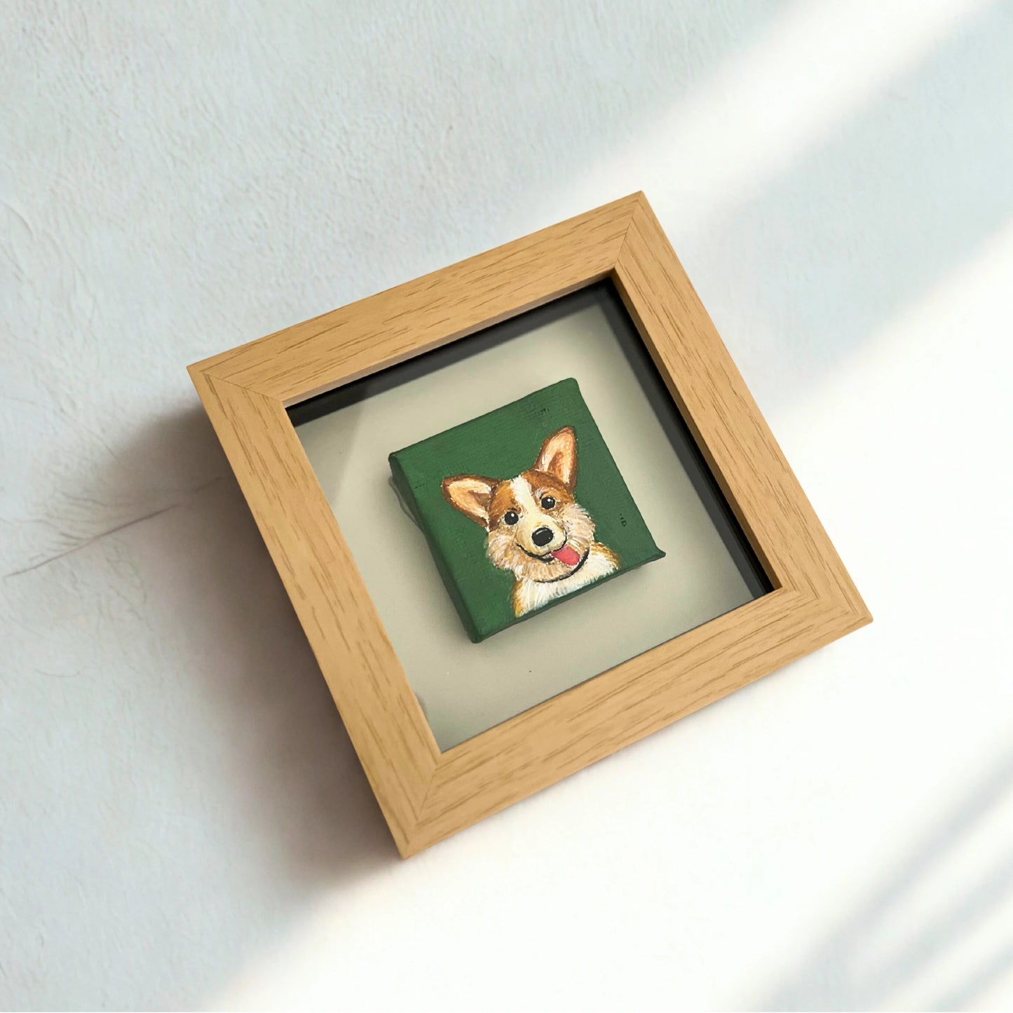 Framed artwork of a dog on a green background