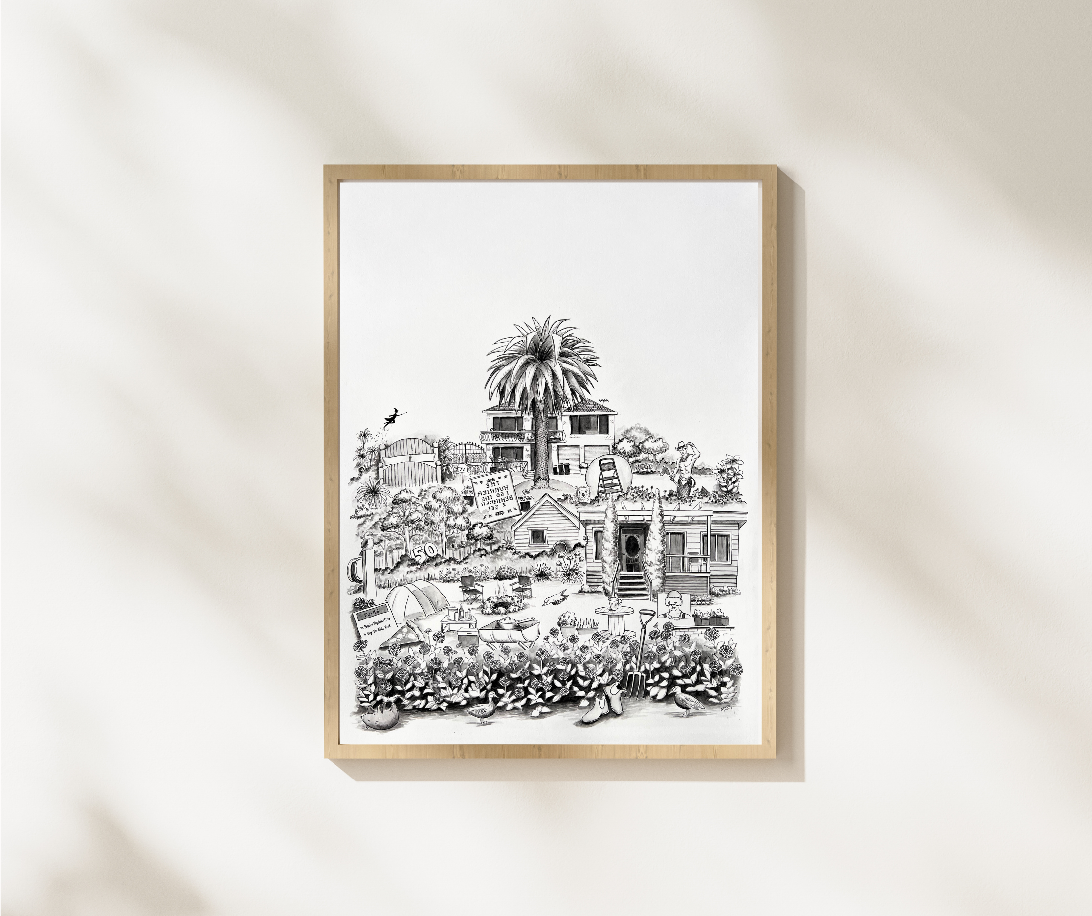 Framed black and white illustration of a customer's story featuring their love of gardening, framed in a wooden frame on a shadowed wall